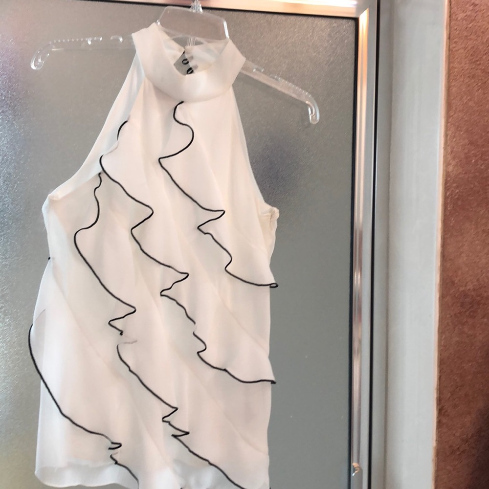 White ruffles blouse,24” in length and 15”across in back